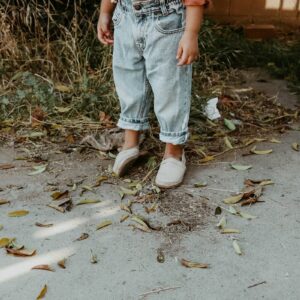person standing on dry leaves