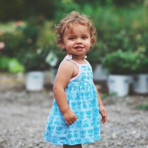 girl wearing blue and white dress